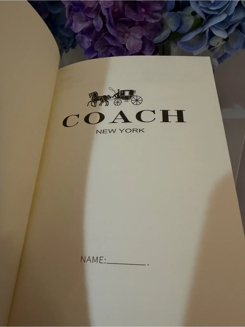 COACH Brown Signature Leather Notebook - COACH New York with a Pen